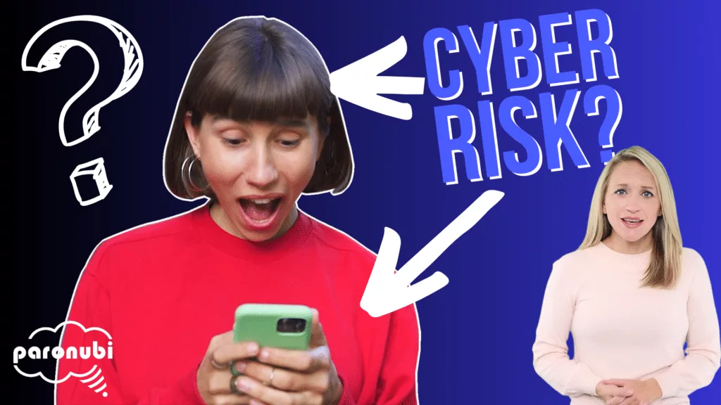 A woman is holding a cell phone displaying the words "cyber risk.